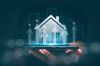 Foto: Hologramm eines Hauses auf einer Hand